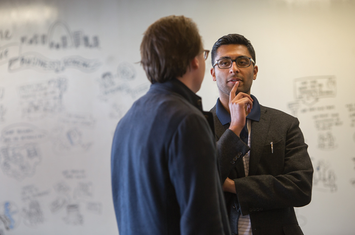 Max Karacz (left), of Hamburg, Germany, and Faisal Delawalla, a Chicago associate, talk during Bryan Cave’s two-day Business Academy for young associates. E-mail invitations sent to the associates read in part, “Are our clients trying to automate us out of existence? How do we lead the law firm of your future in an age of innovation and automation?” <em>Karen Elshout</em>
