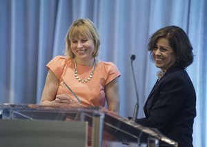 Claire Battle (left) of ArcelorMittal USA accepts the Exelon Outstanding Corporate Counsel Award from Jan Stern Reed.