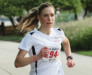 Emily Larrimer Savas of Locke Lord hits another gear as the top female finisher at the 20th annual Race Judicata in Grant Park, completing the course in 19 minutes, 16 seconds. 