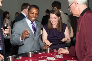 Rufus V. Barner III, a contract attorney at Miroballi Durkin & Rudin, and his wife, Claire, enjoy some good luck at the blackjack table during the Illinois State Bar Association’s Young Lawyers Division Soiree at the Hard Rock Hotel. The event raised money for organizations across the state that provide legal assistance to children. About 70 YLD members and guests attended the event, which featured dancing, table games and a raffle. 