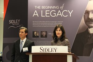 Former federal prosecutors David H. Hoffman, now a partner at Sidley Austin and lecturer at University of Chicago, and Juliet Sorenson, now a Northwestern Pritzker School of Law professor, speak at a book launch party on Nov. 15 at Sidley's ofices to celebrate the publication of "Public Corruption and the Law: Cases and Materials" by West Publishing. The event was sponsored by Sidley, Northwestern Pritzker School of Law and the University of Chicago Law School.