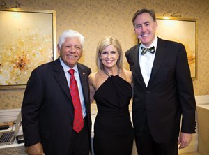 Legendary golfer Lee Trevino poses with Tim and Stacey Cavanagh, partners at the Cavanagh Law Group, at the 2014 Green Coat Gala. The Cavanaghs served as honorary co-chairs of the event that raised morethan $800,000 for the Evans Scholars Foundation.